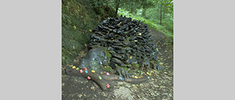 Title: Midnight Feast. Grizedale Forest, Cumbria. Situated in the Forest between Lake Windemere and Lake Coniston. Slate Stone sculpture